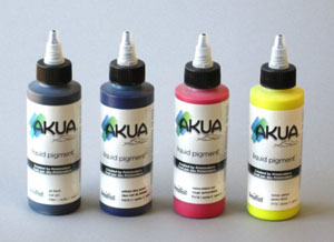 4 bottles in the Akua Liquid Pigment Process Set
